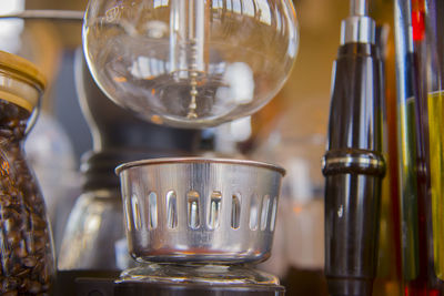 Close-up of wine glasses on table at home