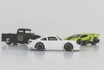 Toy car against white background