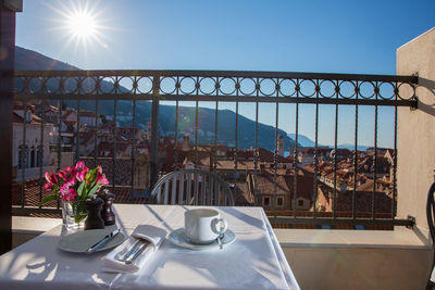 View of potted plants on table at restaurant against clear sky