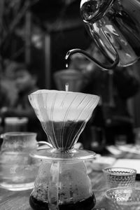 Close-up of coffee cup on glass