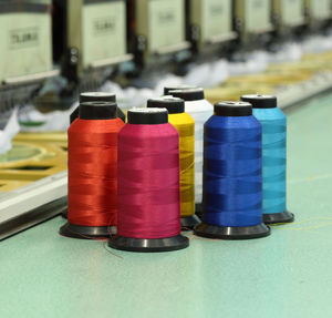 Close-up of multi colored bottles on table