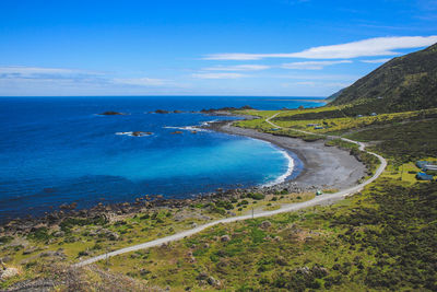 Scenic view of sea against blue sky