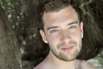 Close-up portrait of smiling young man