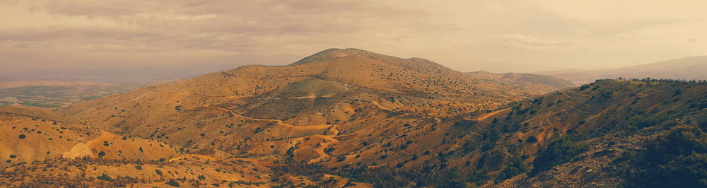 Scenic view of mountains against sky during sunset