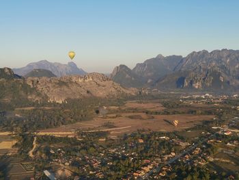 View of landscape with mountain range in the background