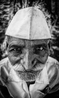 Close-up portrait of man wearing mask outdoors