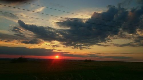 Scenic view of landscape at sunset
