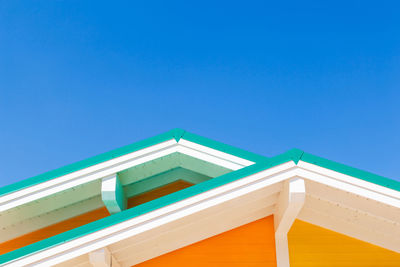 Low angle view of building against clear blue sky