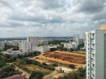 High angle view of buildings in city against sky