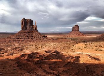 Rock formations in desert against sky