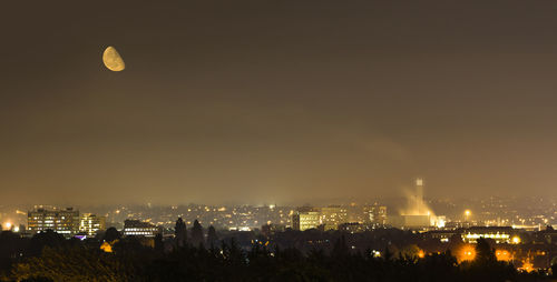 Aerial view of illuminated city at night