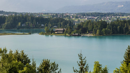 Scenic view of lake and trees against mountains