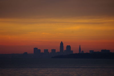 Silhouette of city at sunset