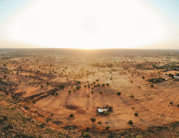 View of desert against sky during sunset