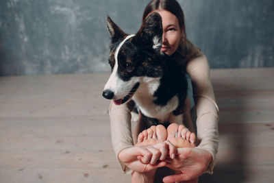 Full length of woman holding dog