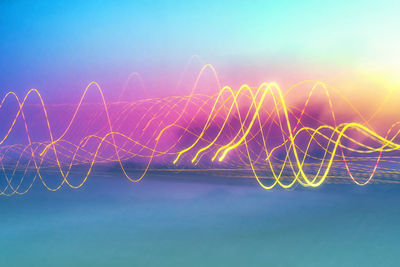 Light trails against sky at night