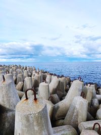 Rocks on beach against sky