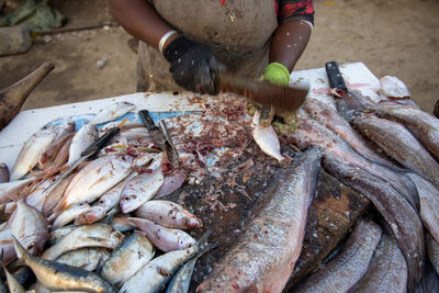 Close-up of fish preperation at market in senegal africa.