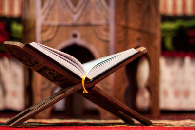 Quran-holy book of muslims, an open book on a stand with rosary