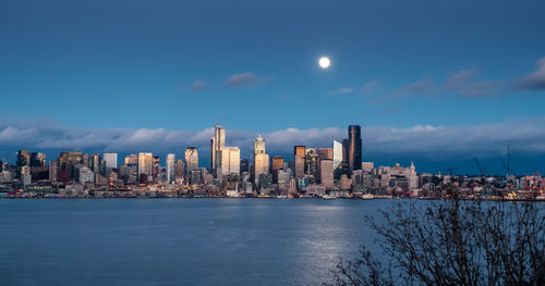 Full moon over the seattle skyline.