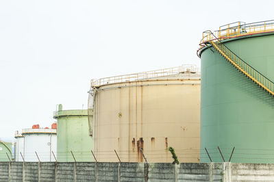 Low angle view of factory against clear sky