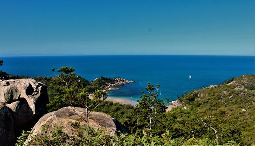 Scenic view of sea against clear blue sky