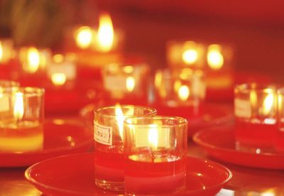 Close-up of tea light candles on table