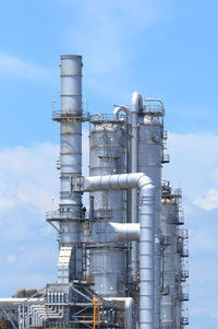 Low angle view of smoke stack against sky