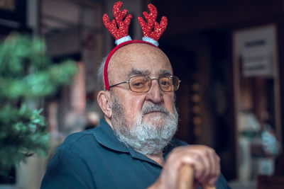 Portrait of senior man smoking cigarette