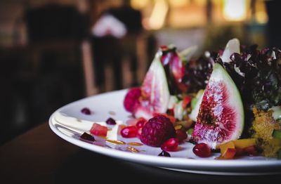 Close-up of strawberries in plate on table