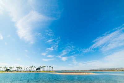 Scenic view of sea against blue sky