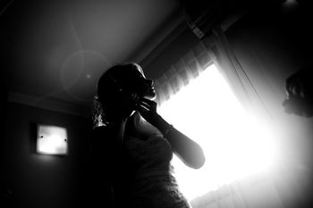 LOW ANGLE VIEW OF WOMAN TAKING SELFIE