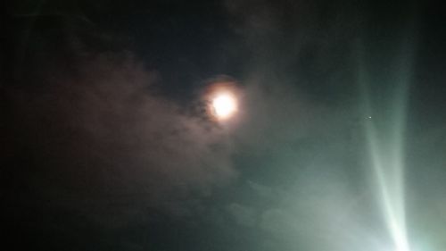 Low angle view of moon in sky at night