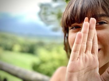 Close-up of human hand against blurred background