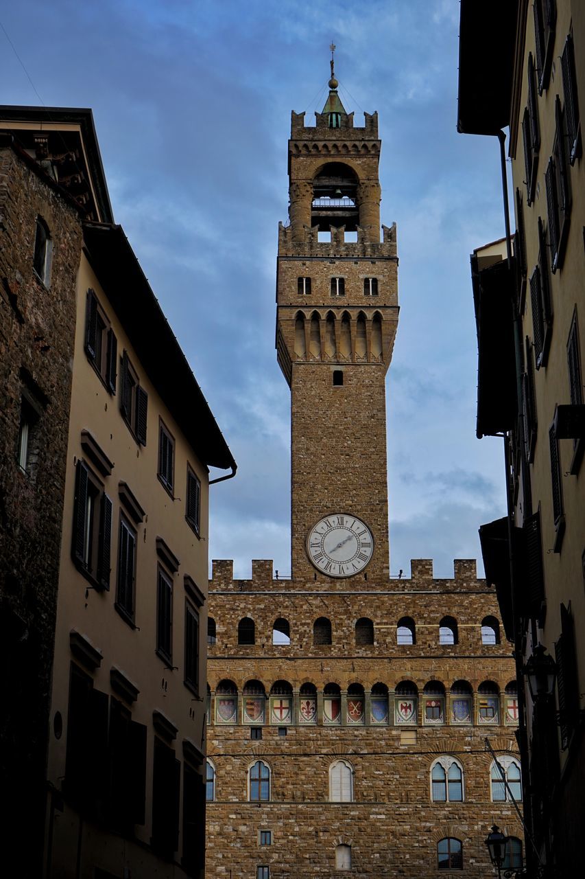 LOW ANGLE VIEW OF CLOCK TOWER IN CITY