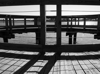 Shadow of railing on water