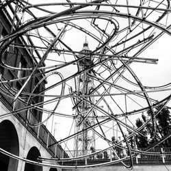 Low angle view of ferris wheel against sky