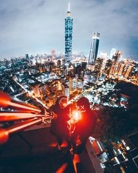 High angle view of illuminated cityscape at night