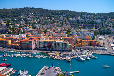 High angle view of harbor by buildings in city