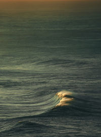 Scenic view of sea against sky at sunset