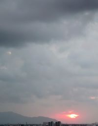 Scenic view of storm clouds in sky during sunset