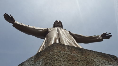 Low angle view of statue against sky