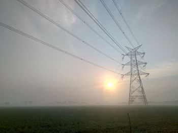 Scenic view of field against sky during sunset