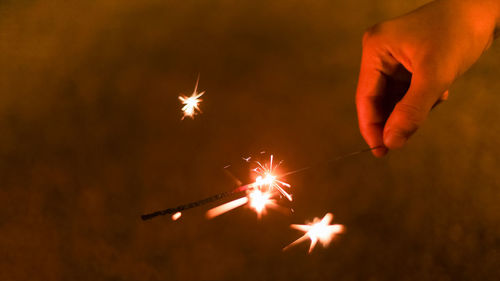 Low angle view of firework display at night