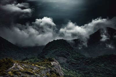 Scenic view of mountains against sky at night