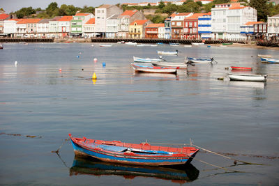 Boats moored at harbor