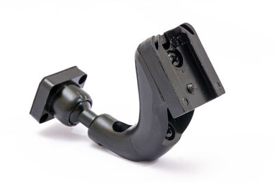 Close-up of machine part against white background