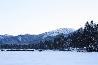 Scenic view of snowcapped mountains against clear sky