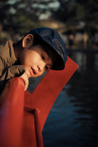 Cute boy looking at river