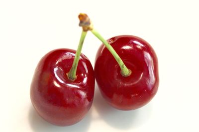 Close-up of red apple on white background